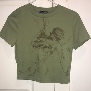 I am selling this Olive Green shirt/blouse with design in front!